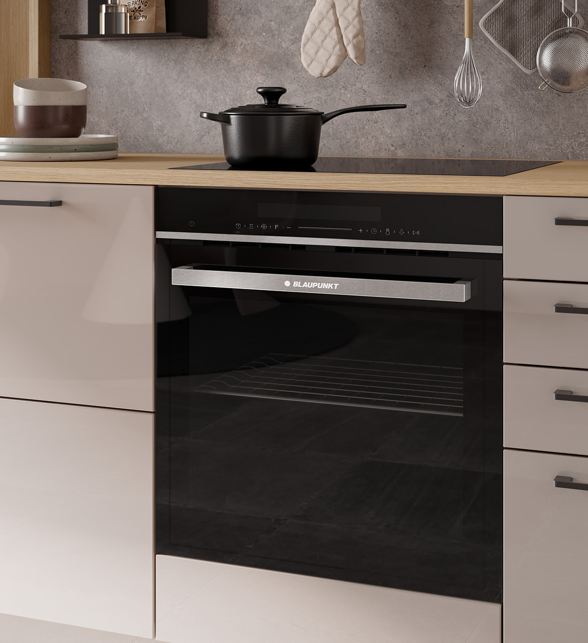 Sandbeige Häcker Küche mit Holzarbeitsplatte und schwarzem Blaupunkt Einbaubackofen