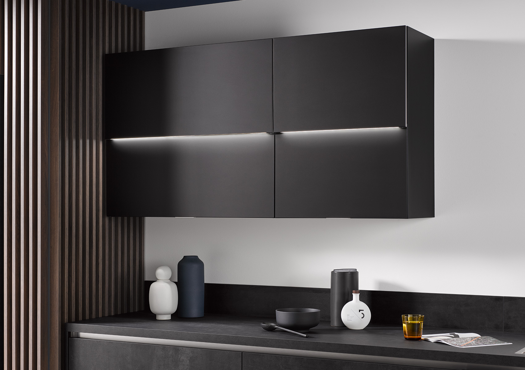 Three views of the black SlightLift wall units with LEDs