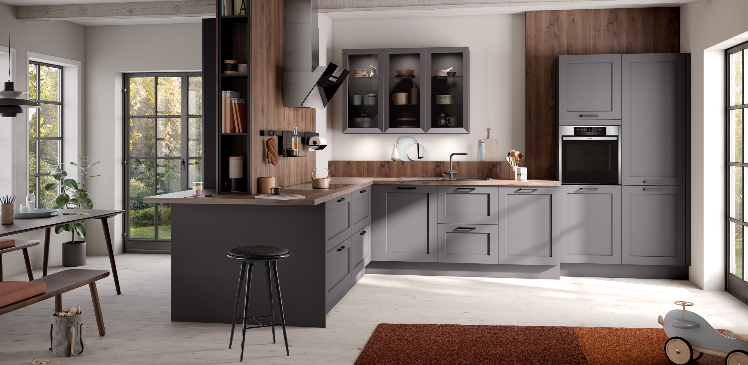 Foto der concept130 ROMA Graphit in der Gesamtansicht mit Küchenzeile, Hochschränken, Oberschränken, Sitzgruppe und Esstisch