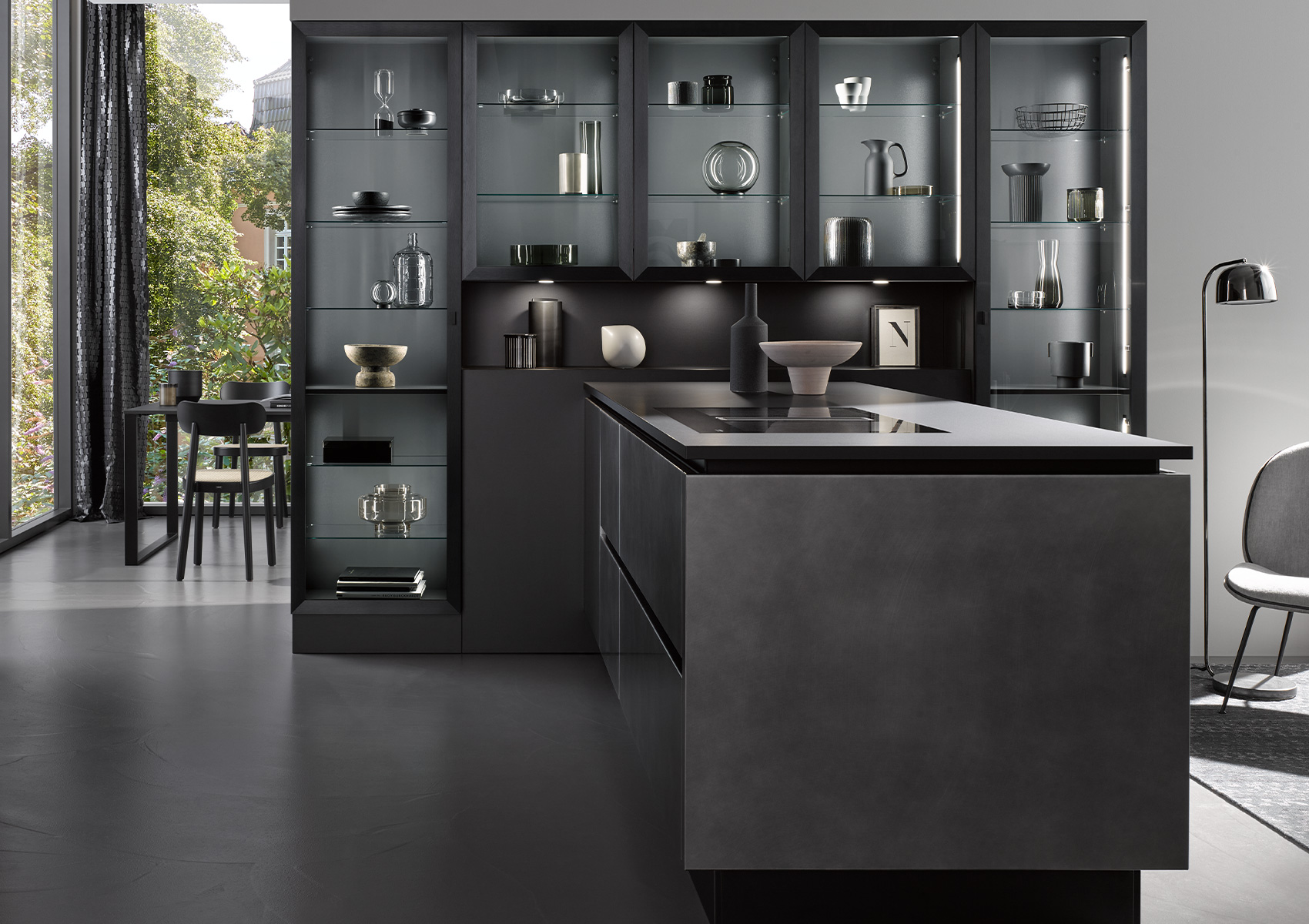 Metal-framed, glass-fronted tall cabinets adjoin the kitchen island with AV 7070 Industrial Steel finish